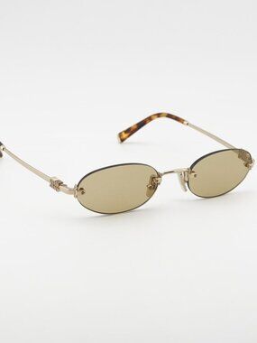 Miu Miu MUA54S ZVN10R Sunglasses Gold Oval Rimless Frame, Yellow Lenses